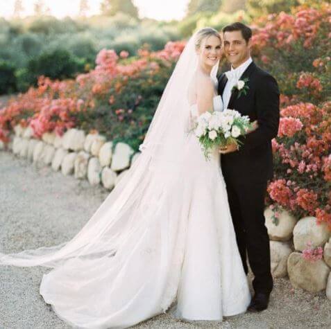 Cassidy Boesch with her husband, Samuel Page, during their wedding.